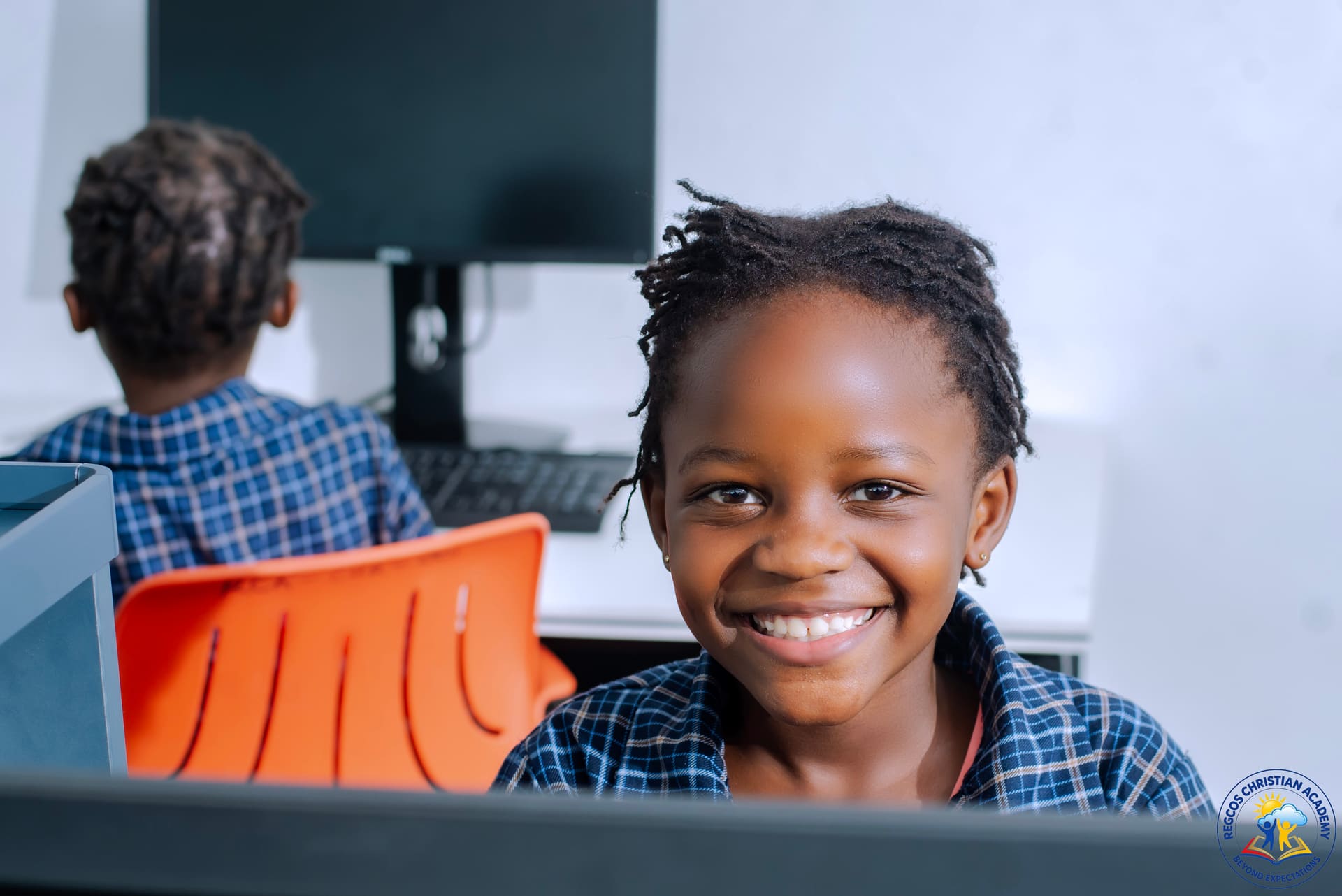 A pupil at her workstation during a computer lesson